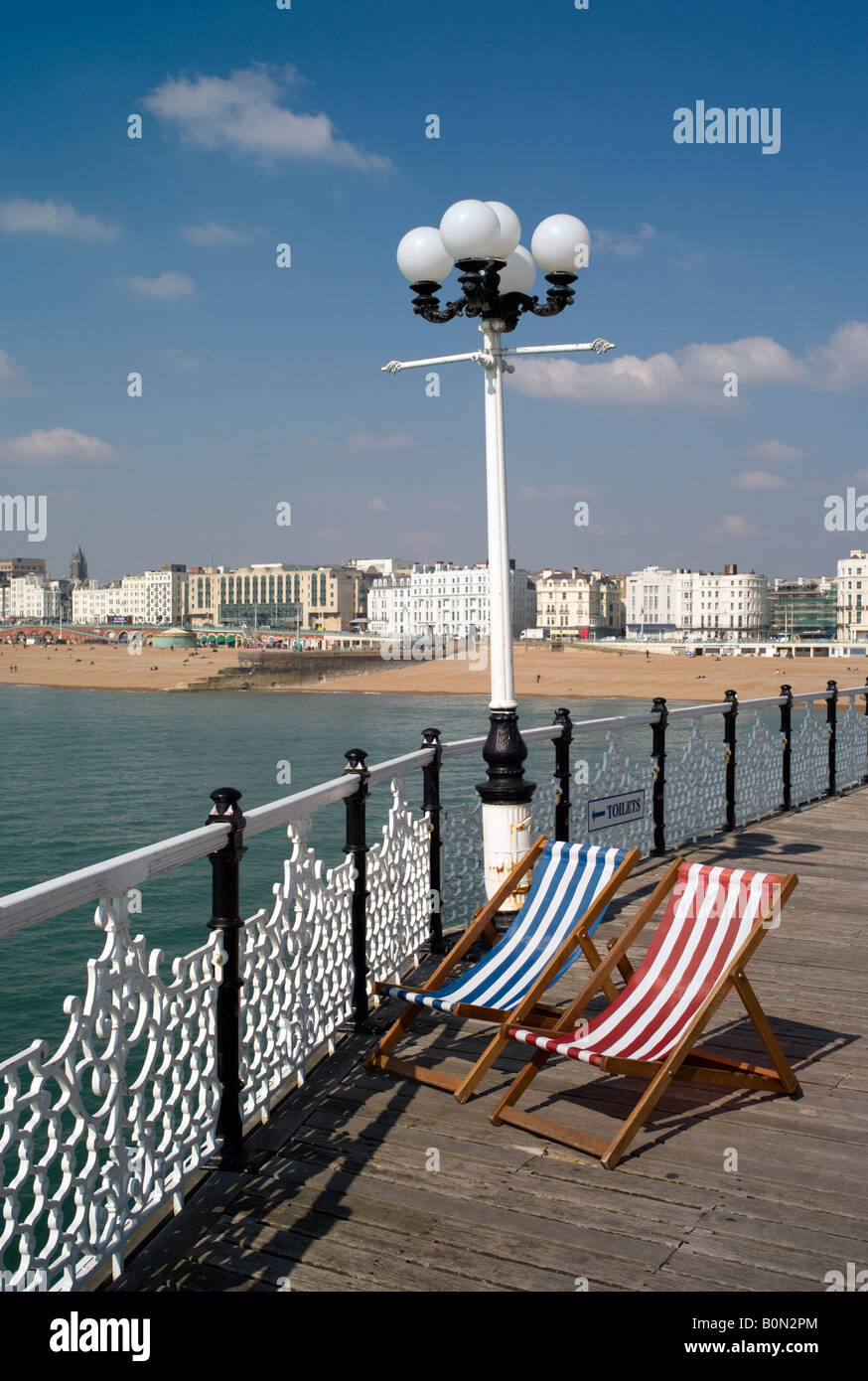 Deckchairs on Brighton Pier (formally Palace Pier) looking towards the city Stock Photo