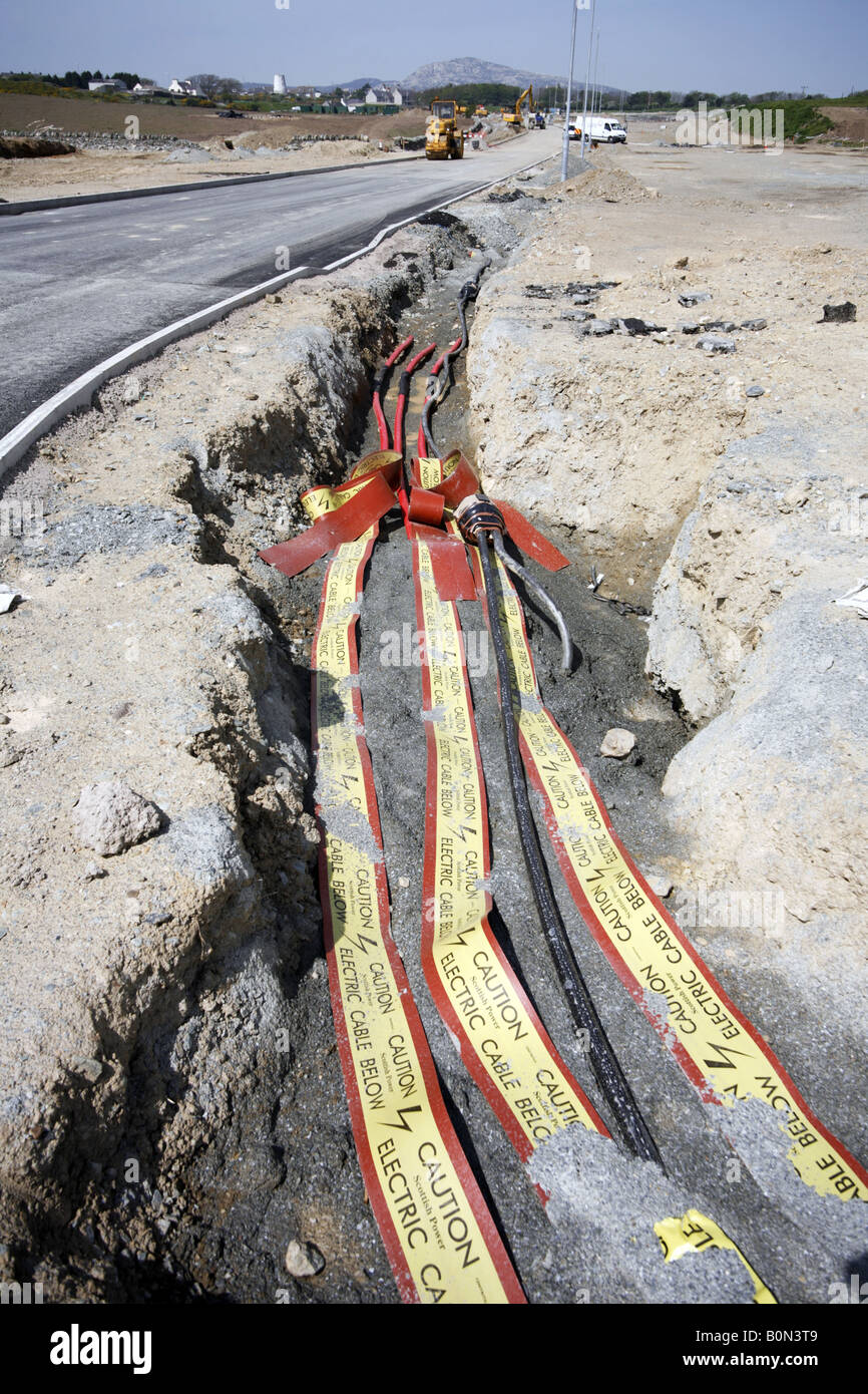 Exposed power cables in roadside trench Warning Tapes in Ground Caution