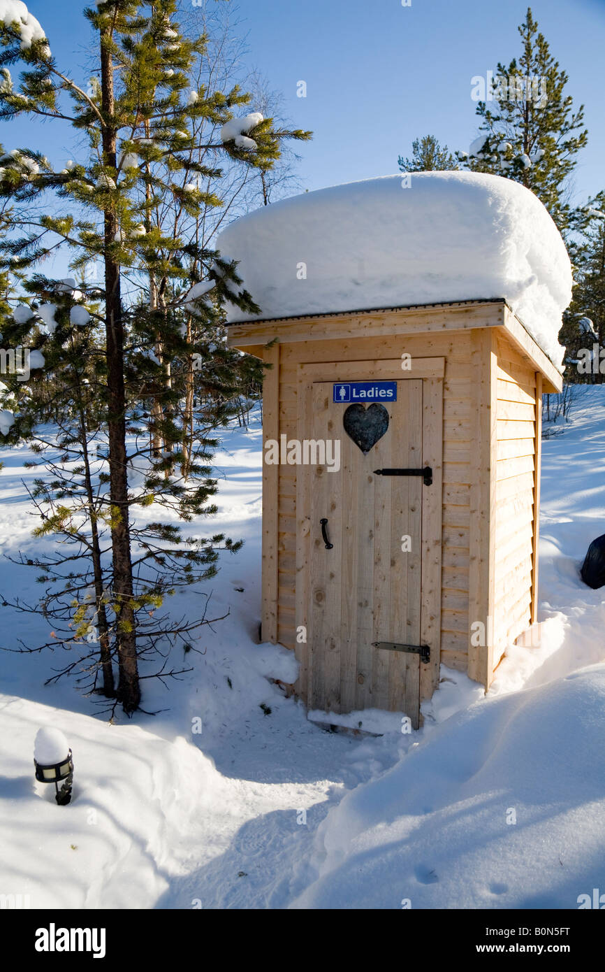 A ladies toilet in the snow in winterly Lapland / northern Sweden Stock Photo