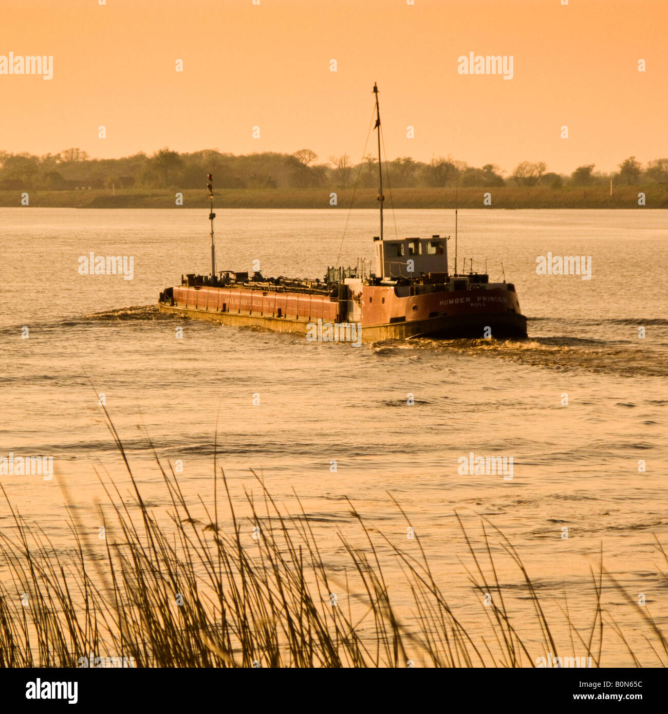 Tanker ship on the tidal River Ouse at Reedness, East Yorkshire, UK Stock Photo