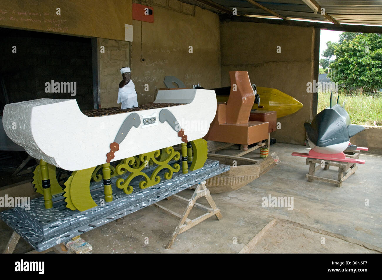 Coffins shaped like a boat, plane, pawpaw and fish on display, Kuluedor, Ghana Stock Photo