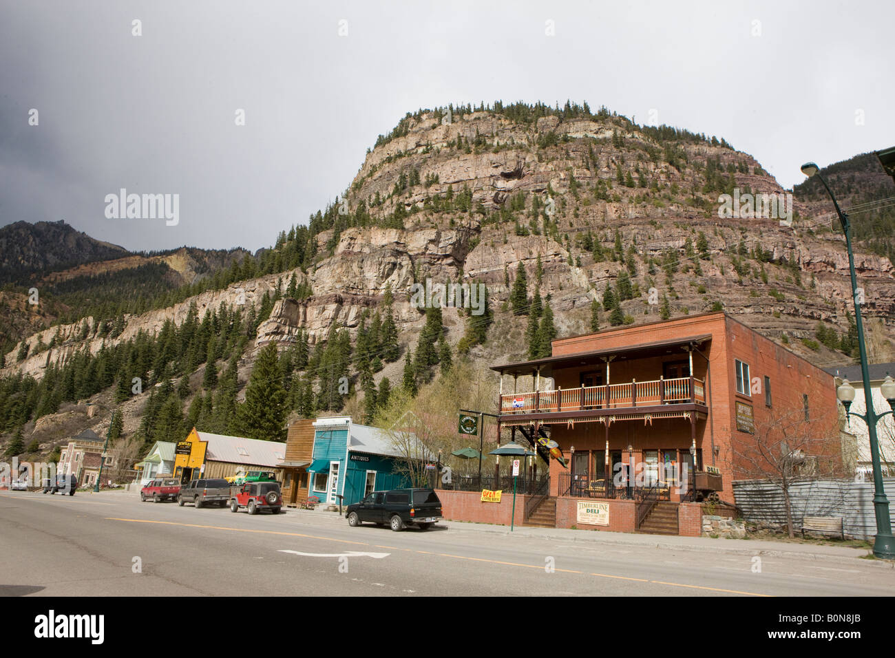 Shops line Main Street San Juan Skyway in Ouray Colorado small town nestled in the mountains nicknamed 'Switzerland of America' Stock Photo