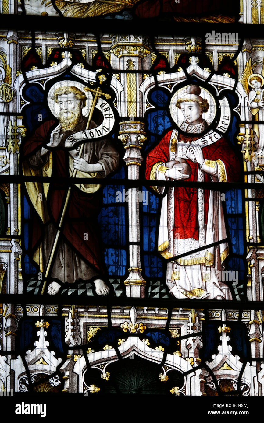 A stained glass window by Lavers, Barraud and Westlake depicting Saints John the Baptist and Stephen, Woodbastwick Church, Norfolk, England Stock Photo