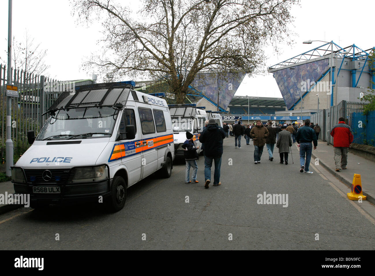 Soccer - Nationwide League Division Two - Swansea City v Millwall. A  policeman in a riot helmet grabs