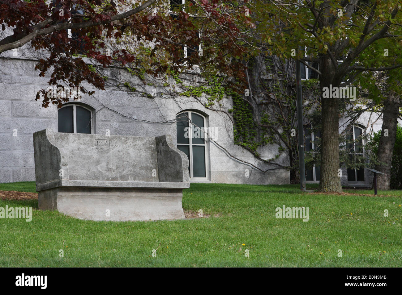 concrete seat in Syracuse University public gardens Stock Photo