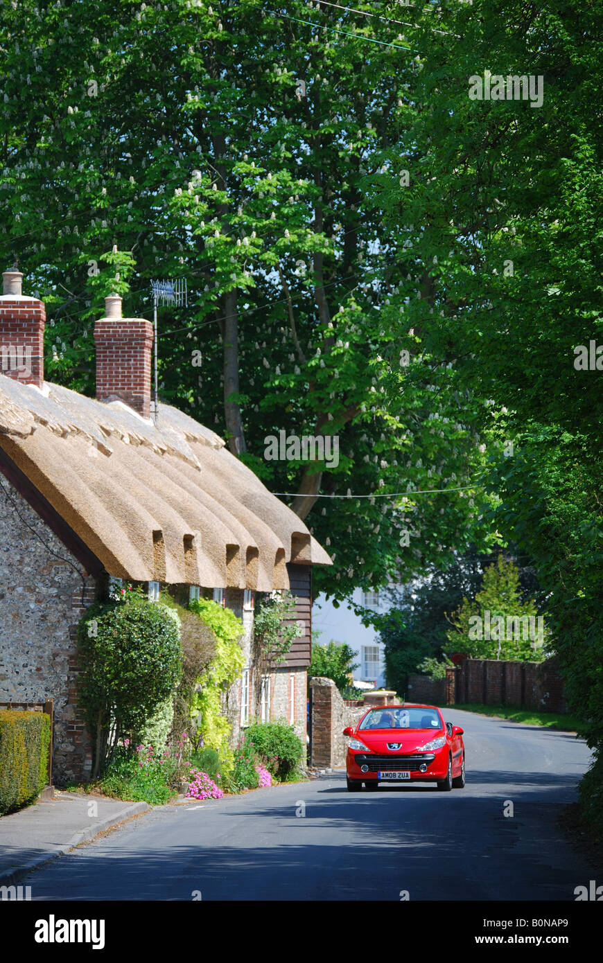 Convertible sports car on road, West Meon, Hampshire, England, United Kingdom Stock Photo