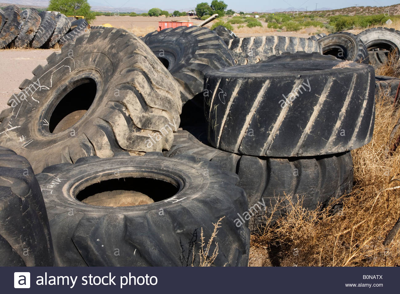 old used mine truck tires tyres heavy equipment tires stacked Stock