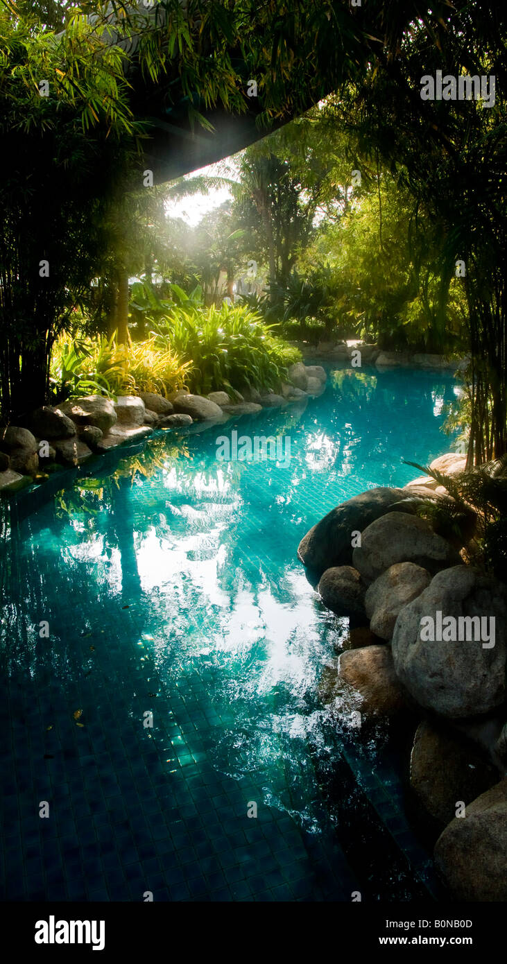 The jungle like swimming pool at the luxury 5 star beach-front Hyatt Regency Hotel Hua Hin Thailand Stock Photo