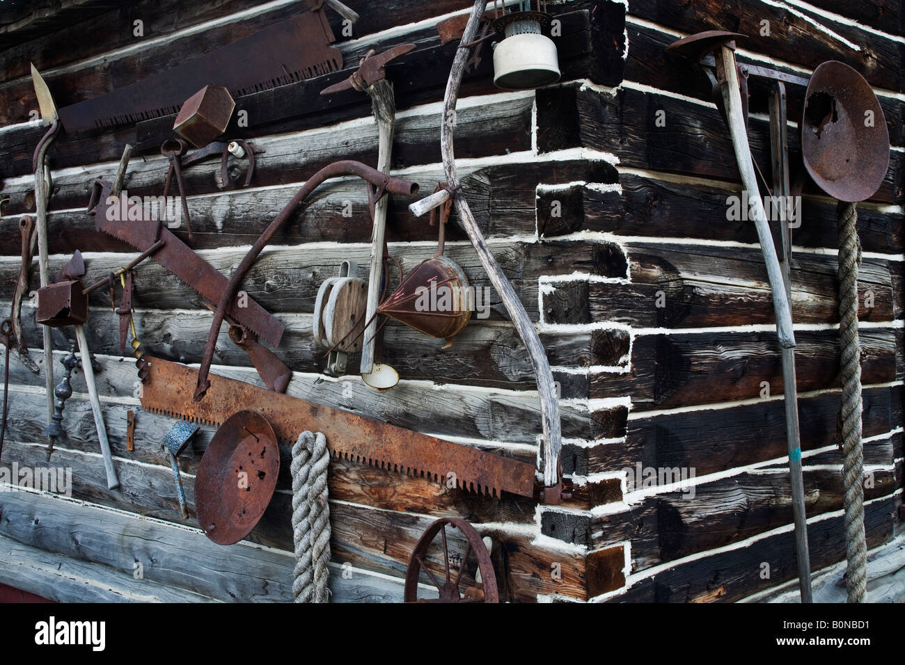 Log Cabin With Various Mining And Logging Tools Hung On The