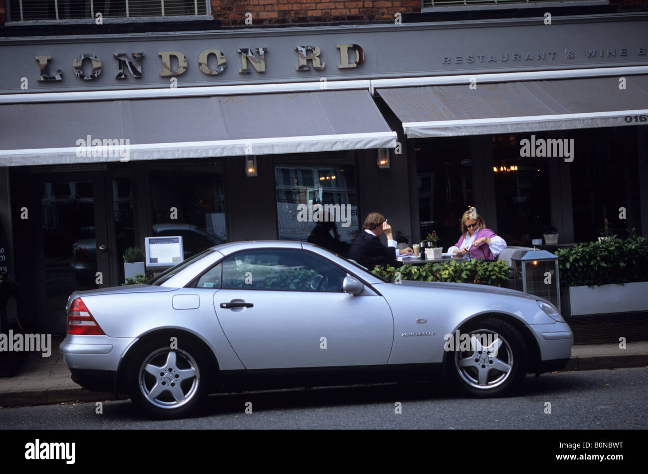 Smart Restaurant With Car Parked Outside In Alderley Edge Cheshire Stock Photo