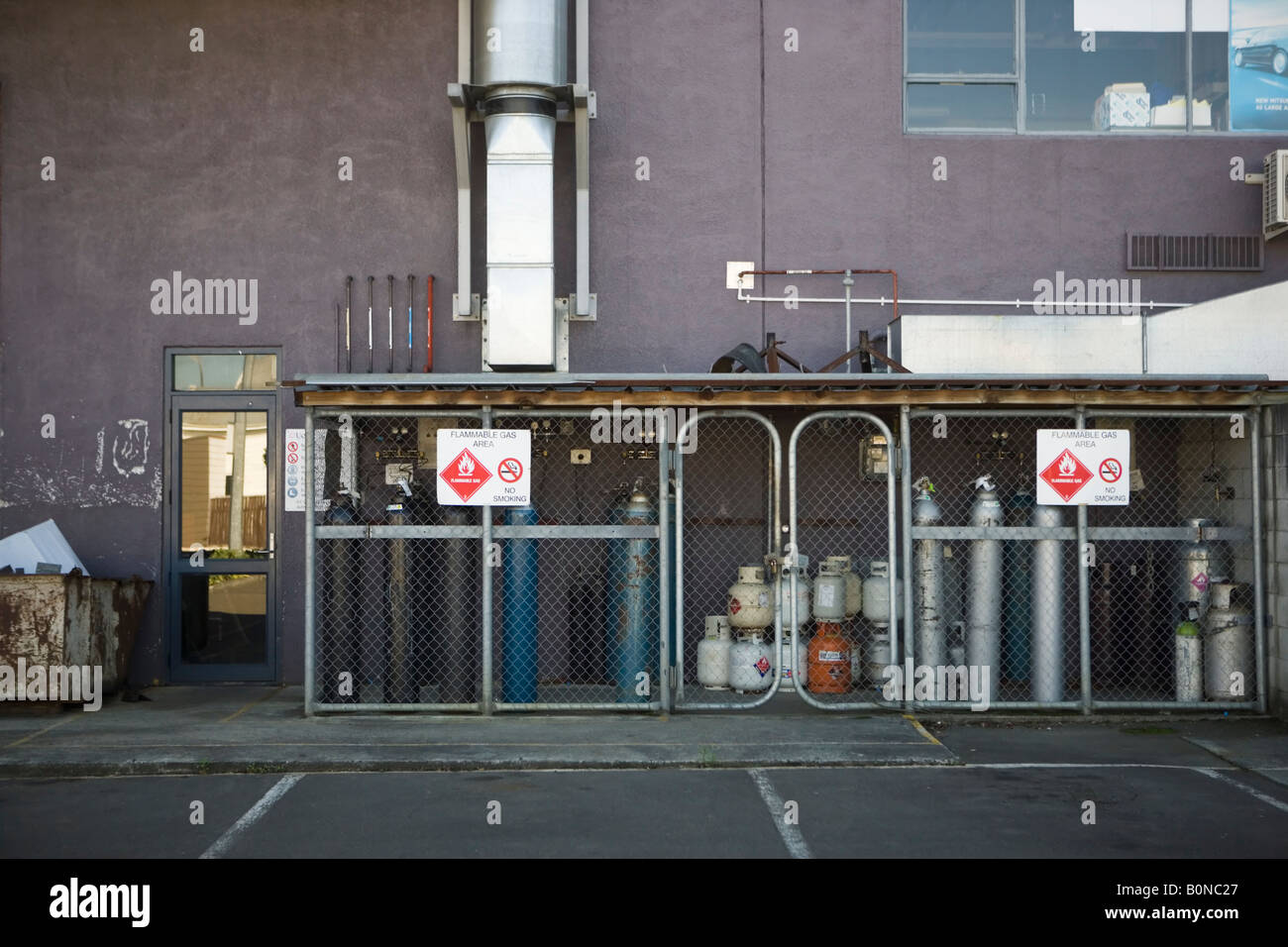 Hazardous gases stored outside a building in a locked chainlink fenced