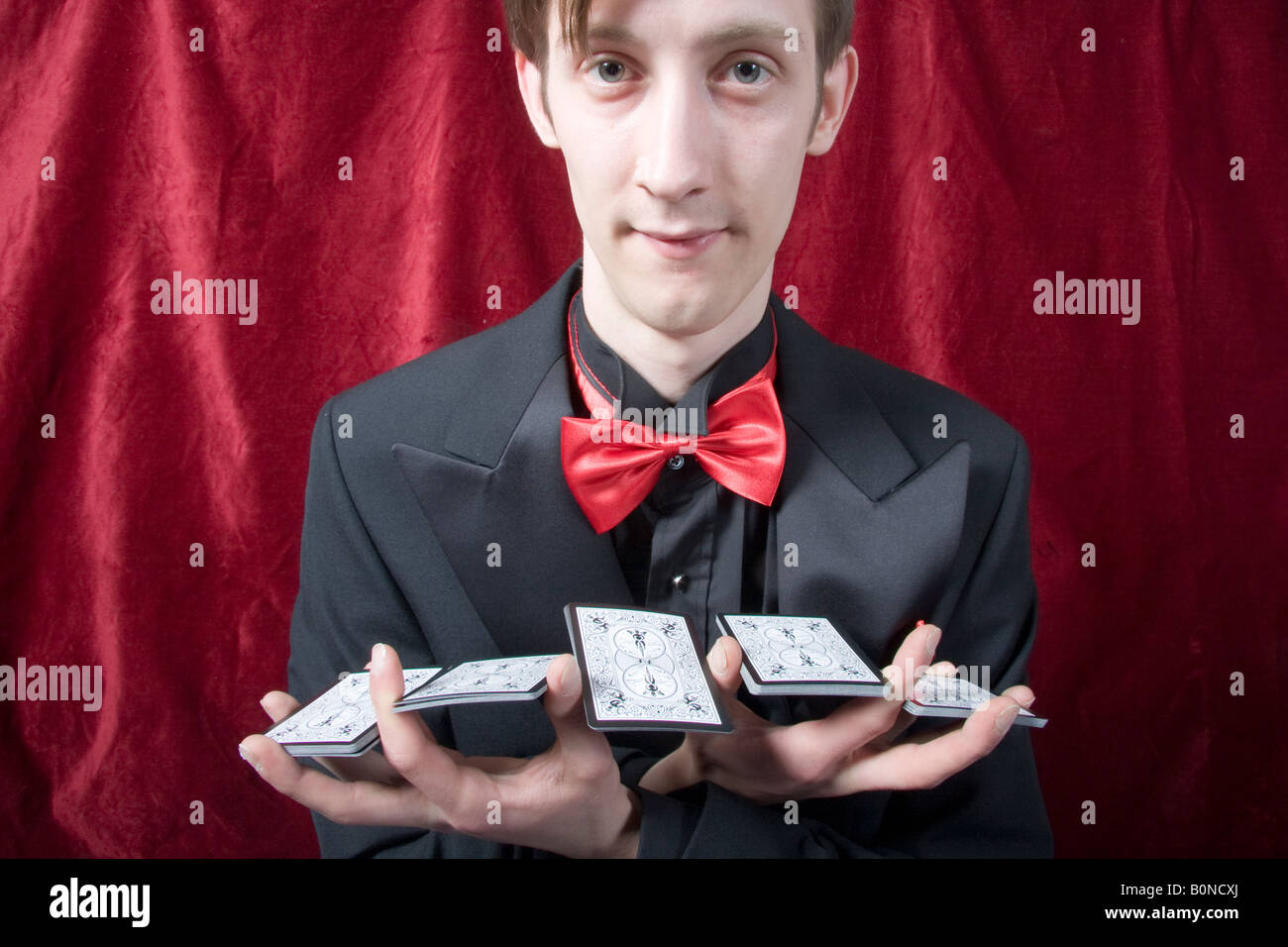 magician performing a card trick Stock Photo Alamy