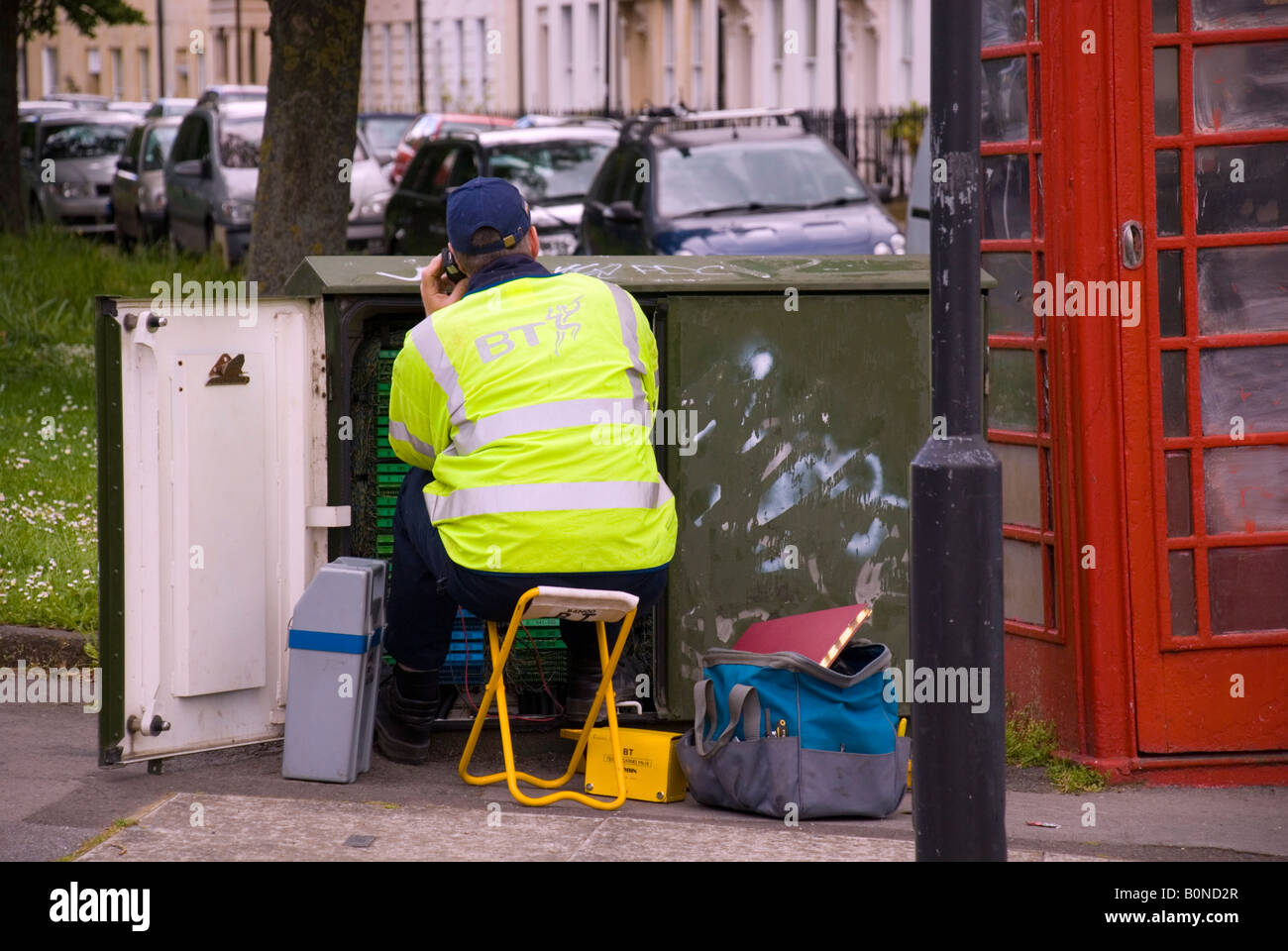 Bath BaNES England UK British Telecom Engineer at work on a junction box in the city Stock Photo