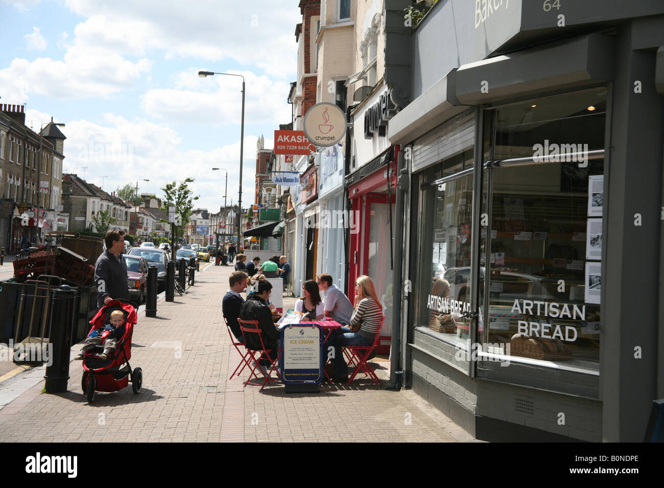 Mothers pushing a pram in Northcote Road London Stock Photo
