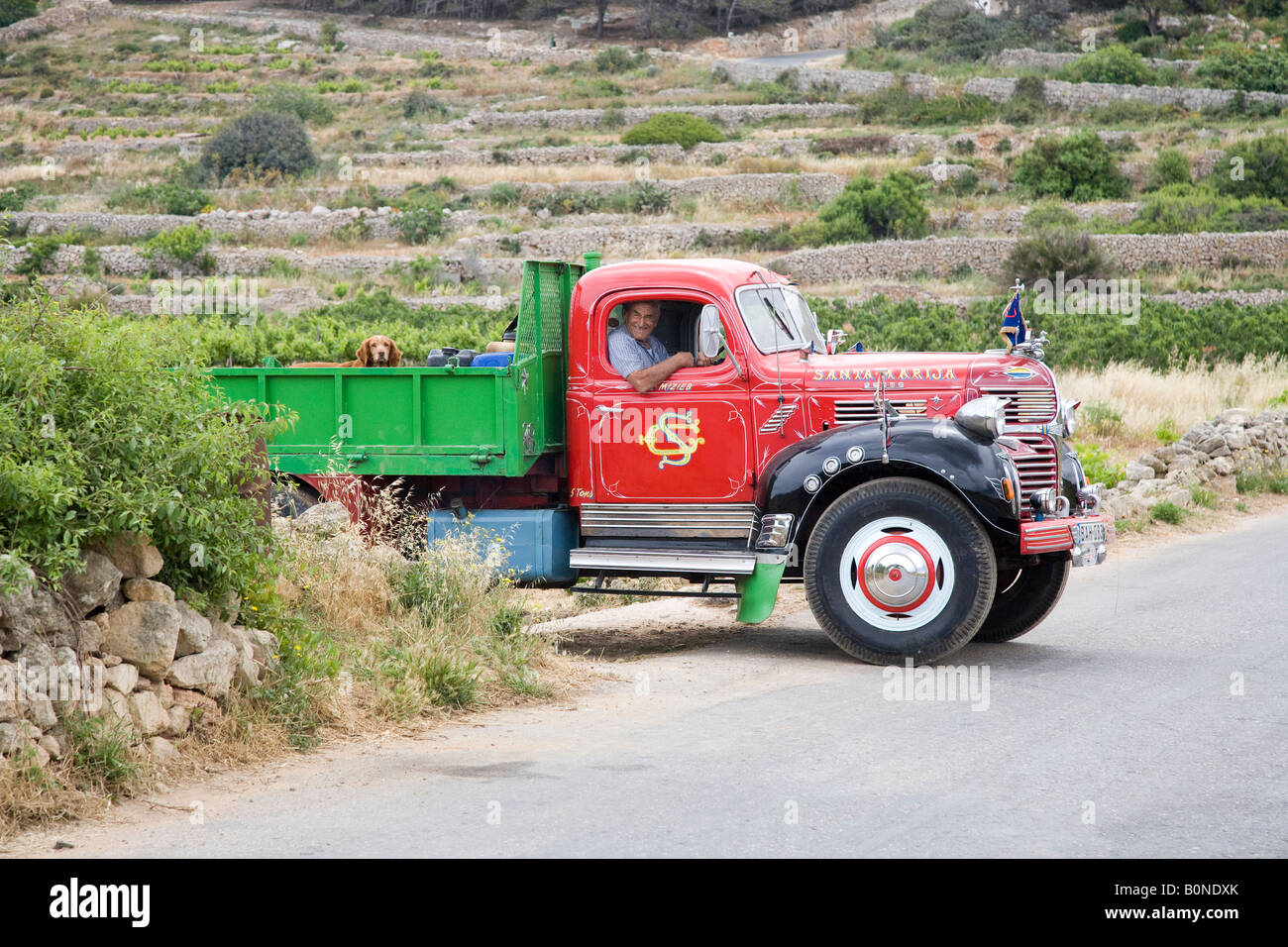 1947 post-war DODGE Tray-Body American Truck. USA Decorated red Maltese flat bed tipper farners truck, Dodge Bedford Truck named Santa Maria Stock Photo