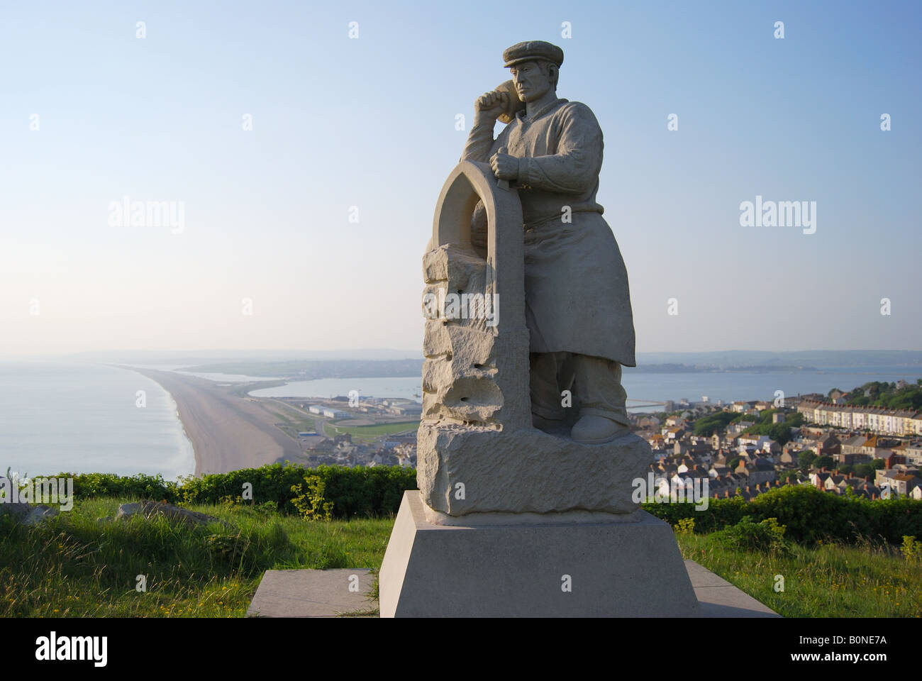 'Spirit of Portland' Statue with Chesil Beach behind, Isle of Portland, Dorset, England, United Kingdom Stock Photo