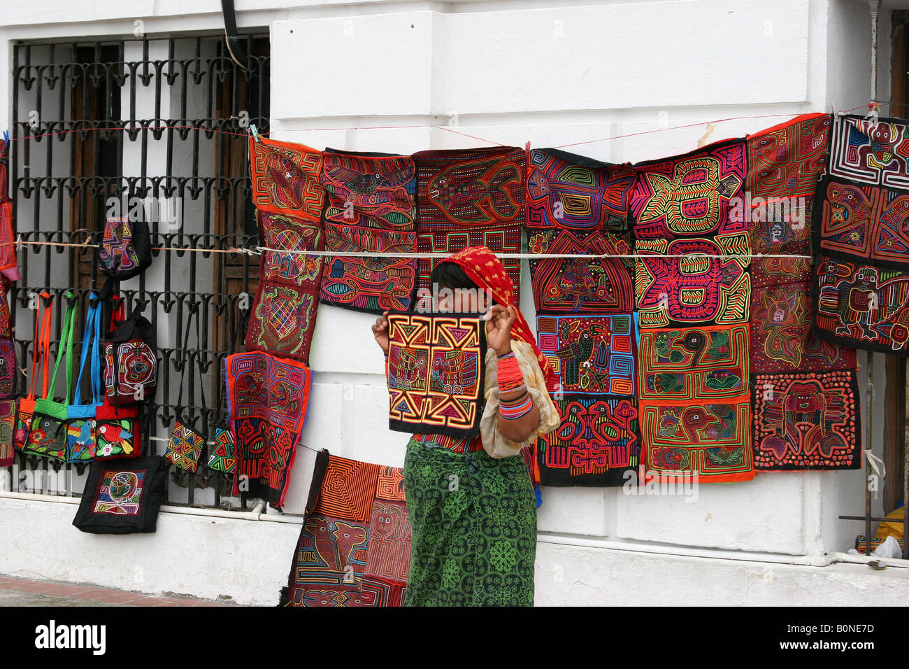 Kuna indian woman selling molas at a street market of Panama City.  For editorial use only. Stock Photo