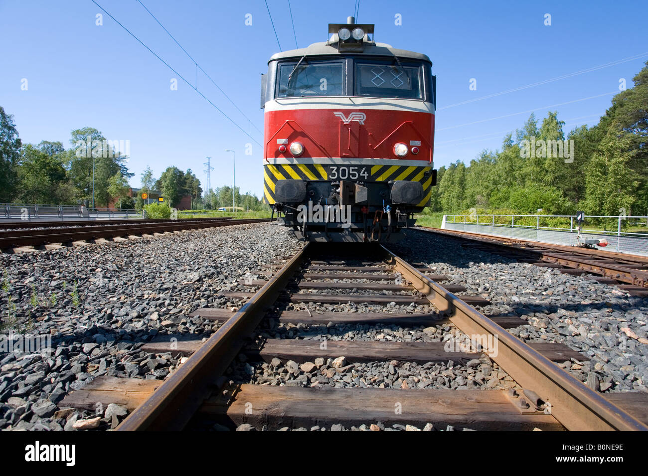 Electric locomotive and wooden sleepers on rails , Finland Stock Photo