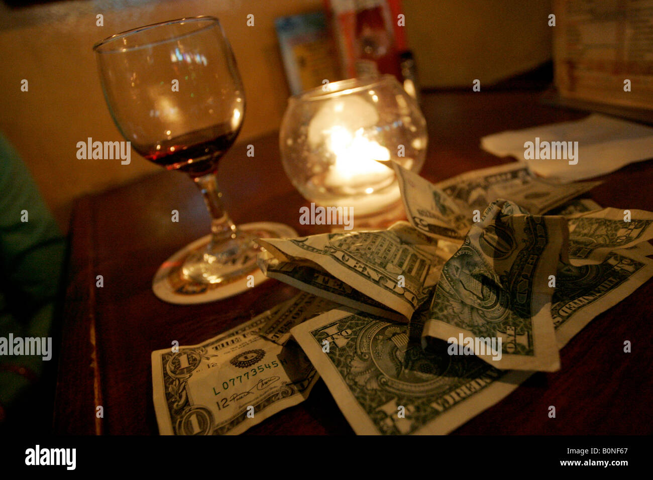 Tip of dollar bills on a table in a bar Stock Photo Alamy