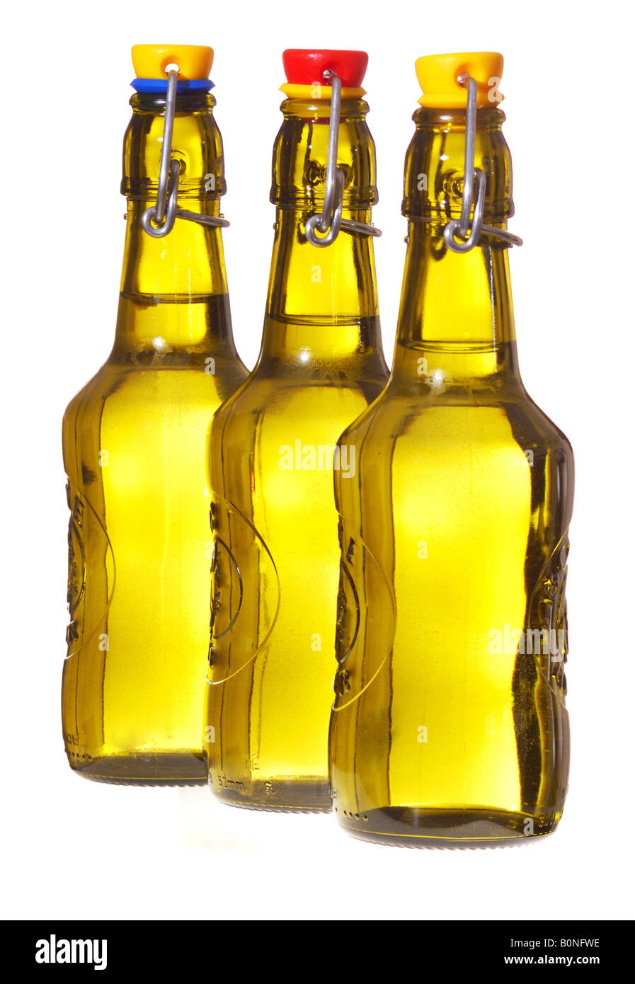Three fliptop beer bottles in a row Stock Photo Alamy