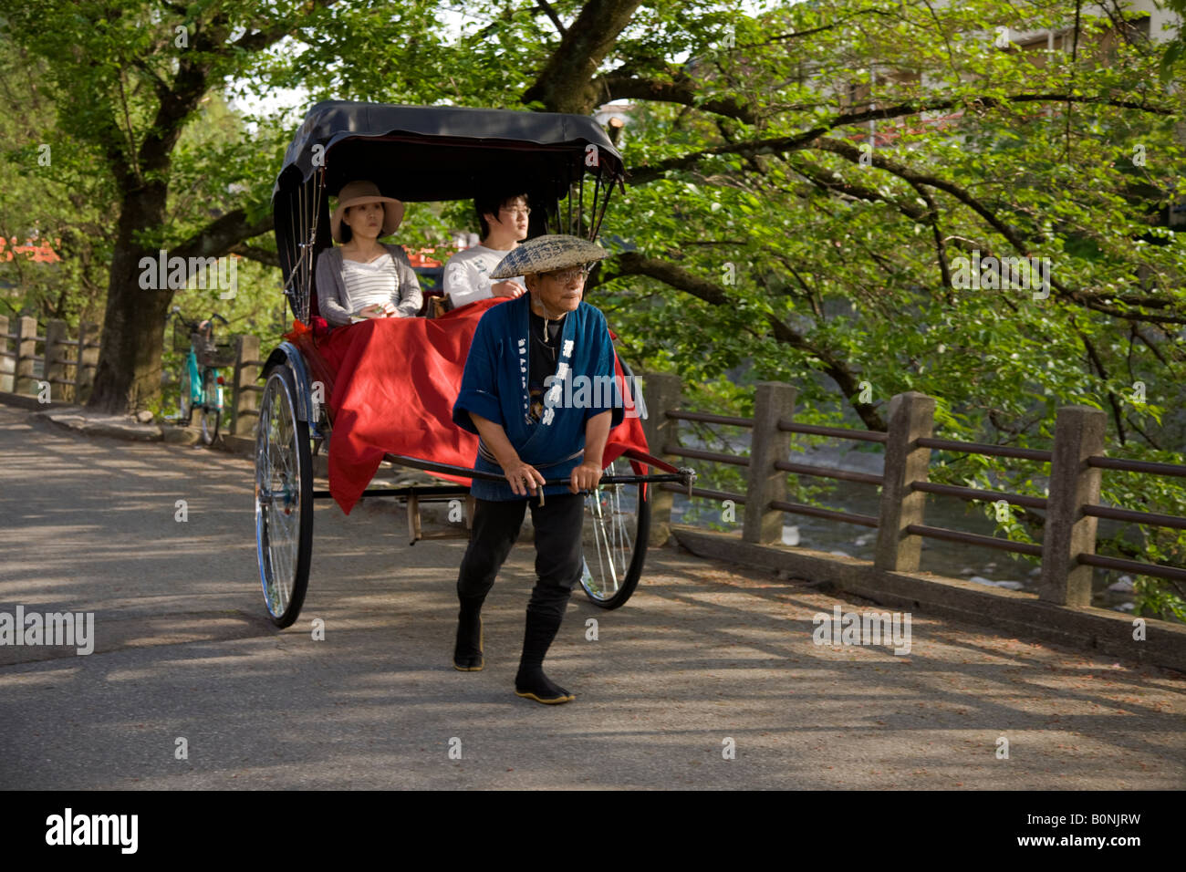 Japanese Rickshaw along the Miyagawa River Stock Photo