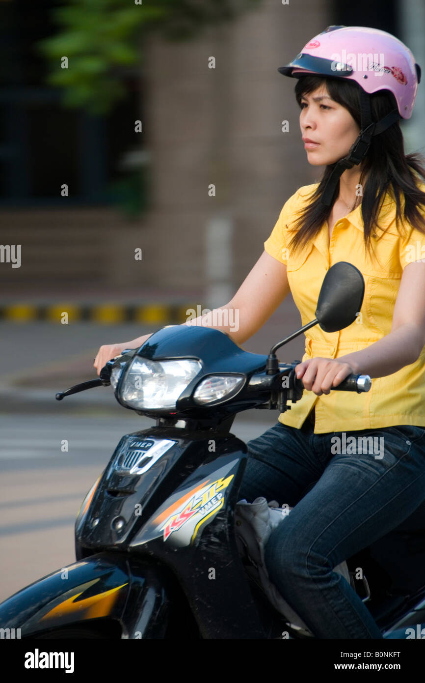 Young woman on a scooter on Trang Tien, Hanoi, Vietnam Stock Photo - Alamy