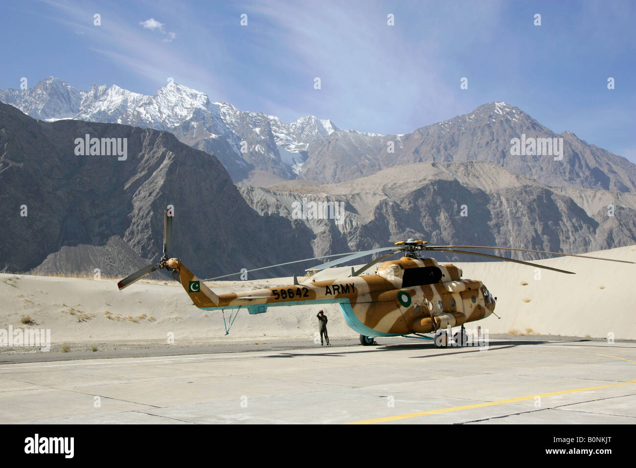 Helicopter on heliport in valleys of Karokoram Mountains Skardu Valley North Pakistan Stock Photo