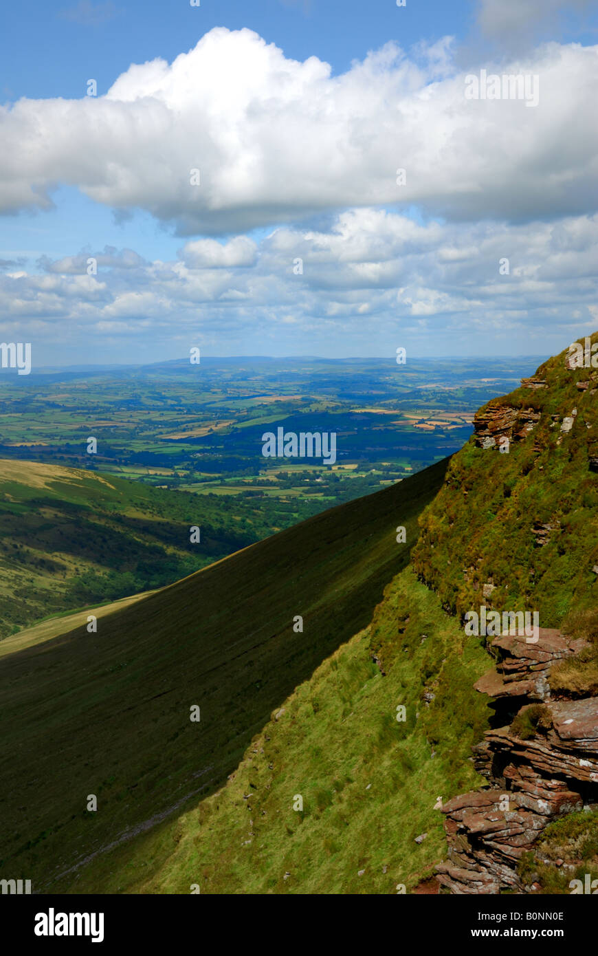 View across Cym Oergwm valley from the Brecon Beacons escarpment, at Craig Cwareli,east of the mountain Fan y Big Stock Photo