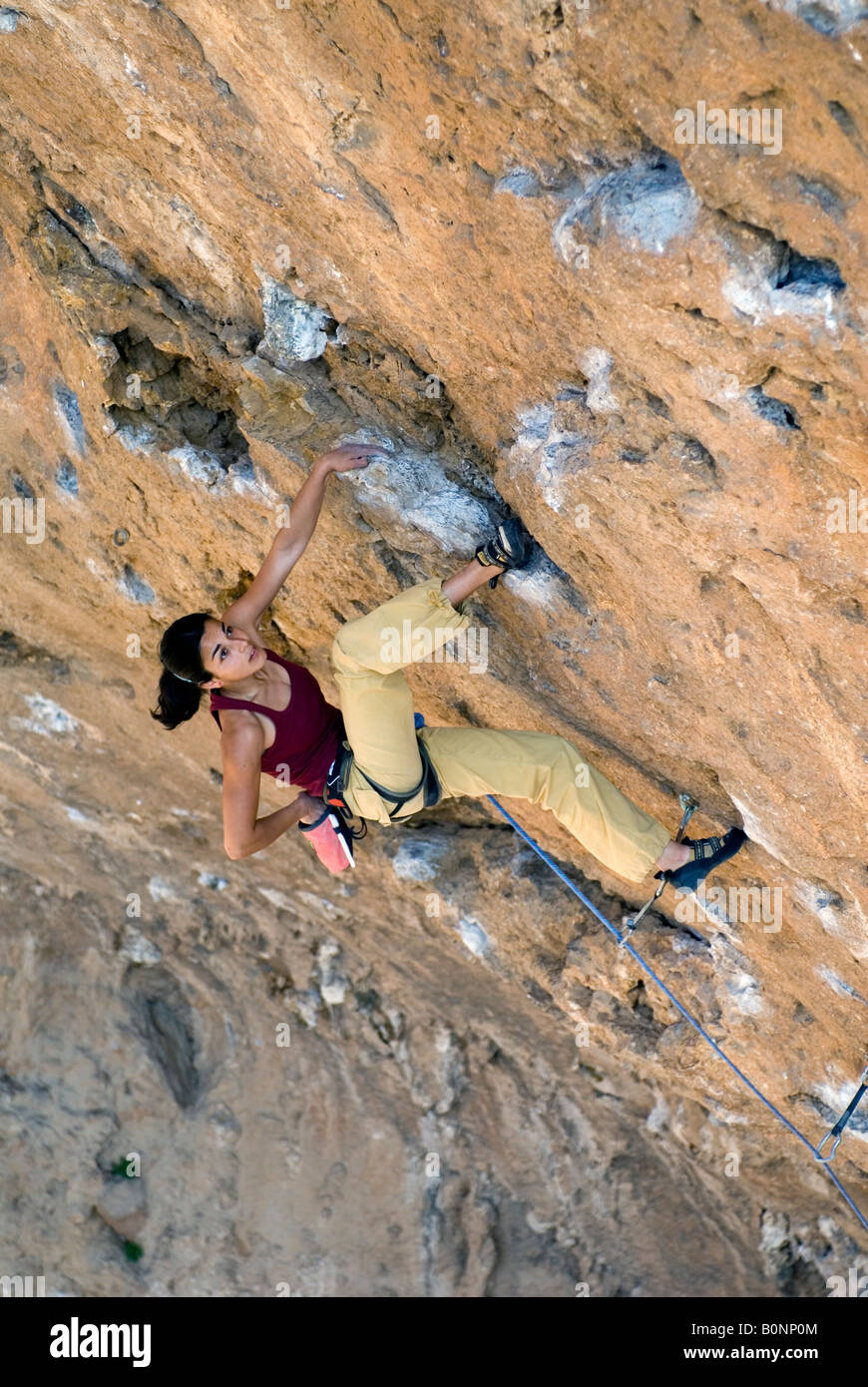 Girl rock climbing Stock Photo - Alamy
