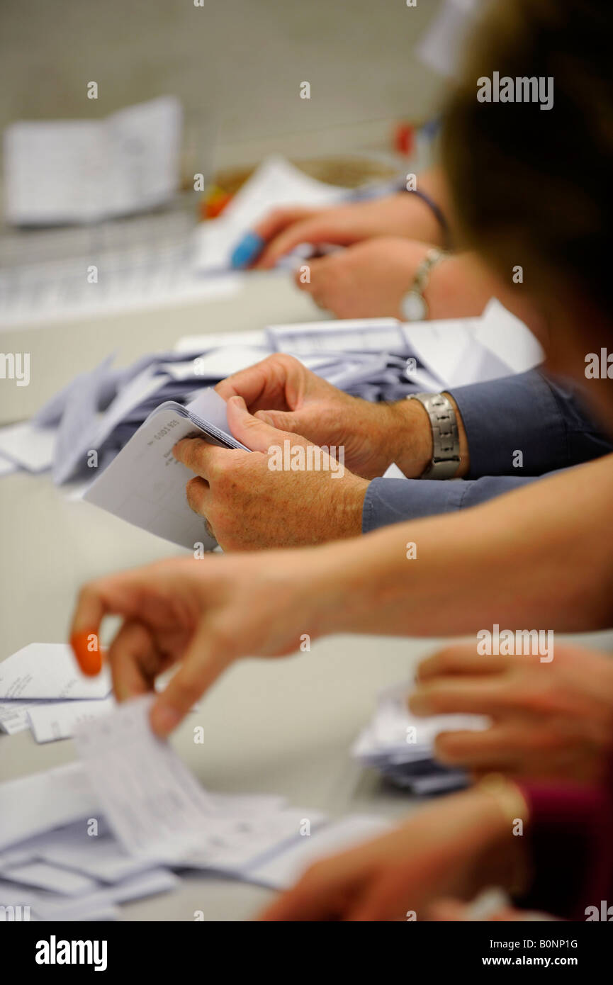 Completed ballot papers are verified before a local UK election count. Picture by Jim Holden. Stock Photo