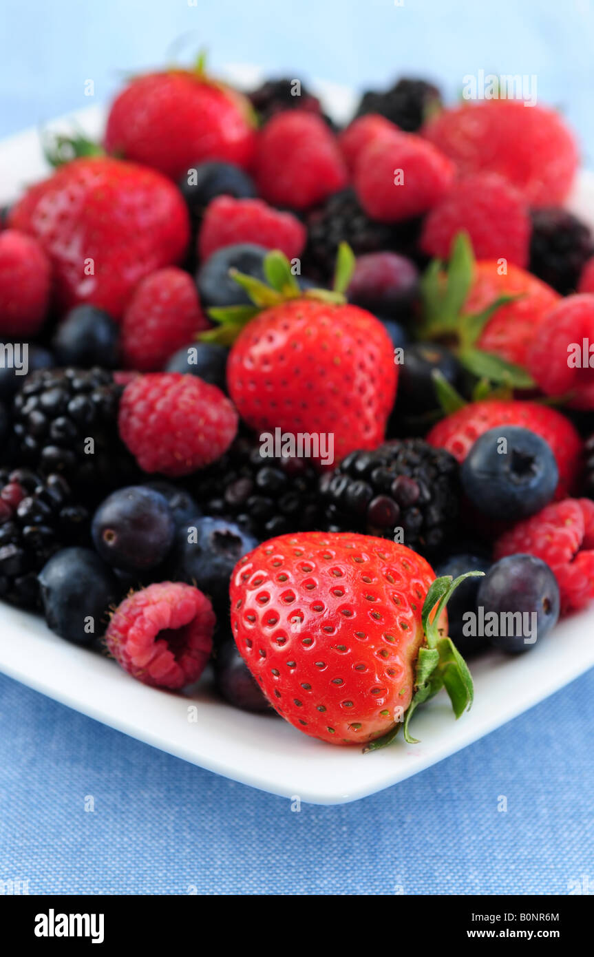 Assorted fresh berries on a plate close up Stock Photo