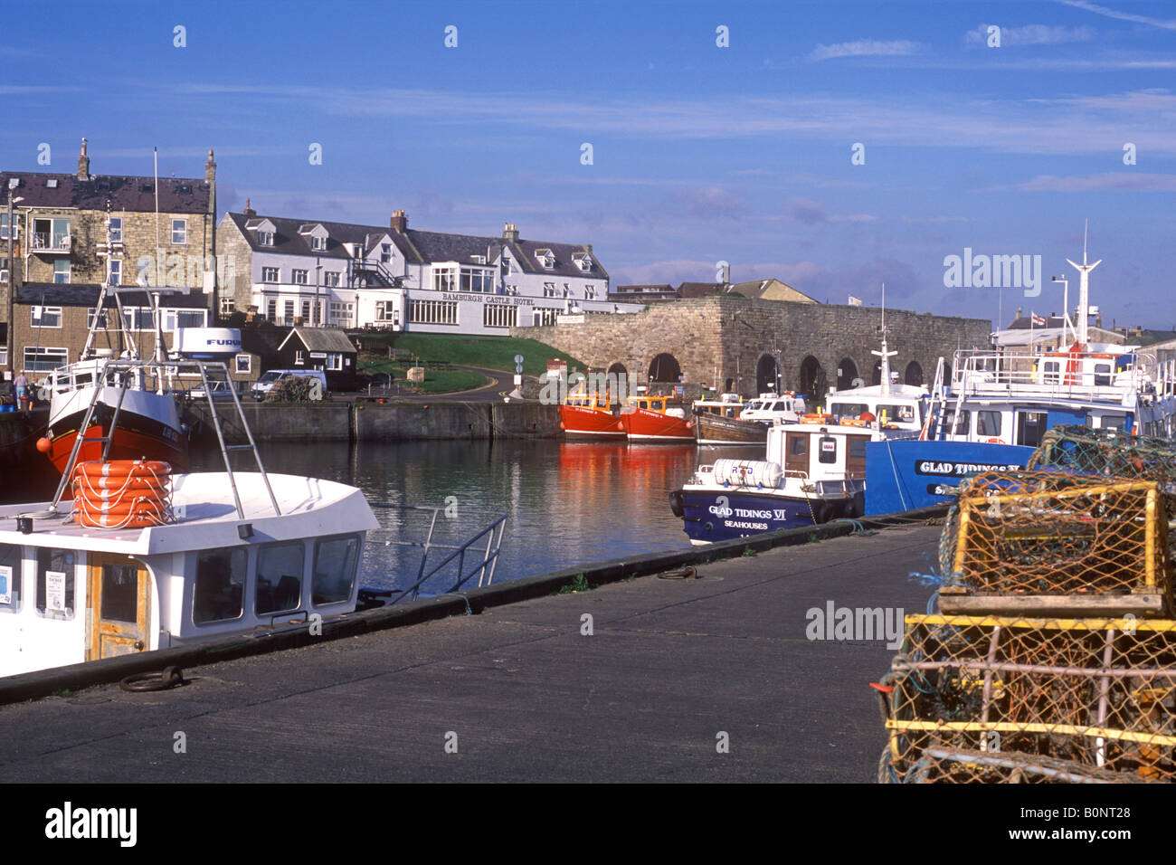 Fishing boats seahouses harbour northumberland hi-res stock photography ...