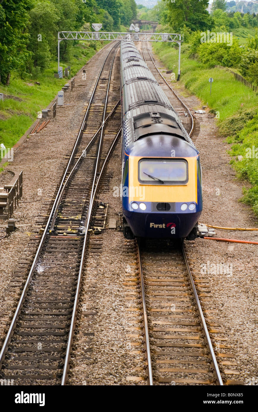 A First Great Western Inter City train passes points at Bathampton BaNES UK en route to London Paddington Stock Photo