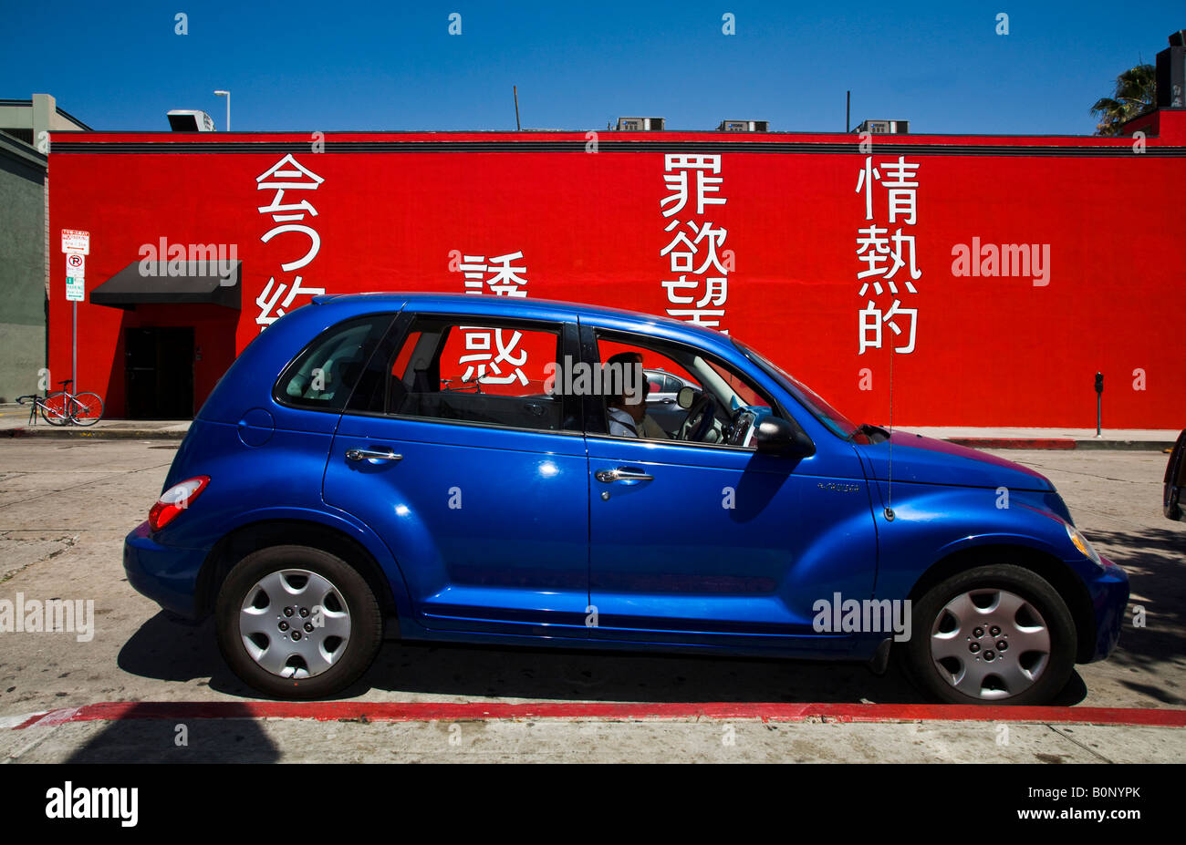 A blue car in front of a restaurant Hollywood (Geisha House) Los Angeles County California USA
