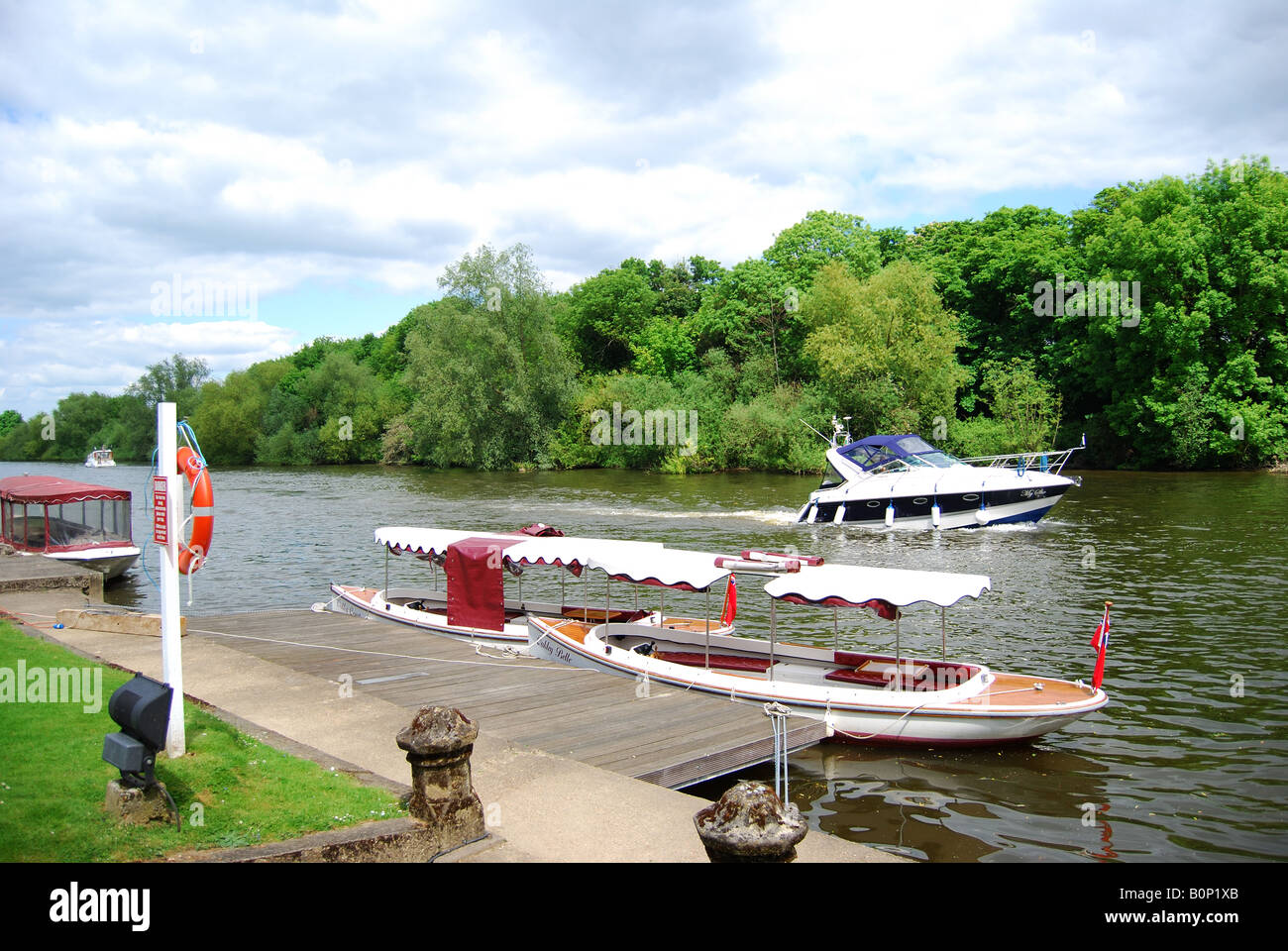 Slipper boats moored on jetty on River Thames, Oakley Court Hotel, Water Oakley, Windsor, Berkshire, England, United Kingdom Stock Photo