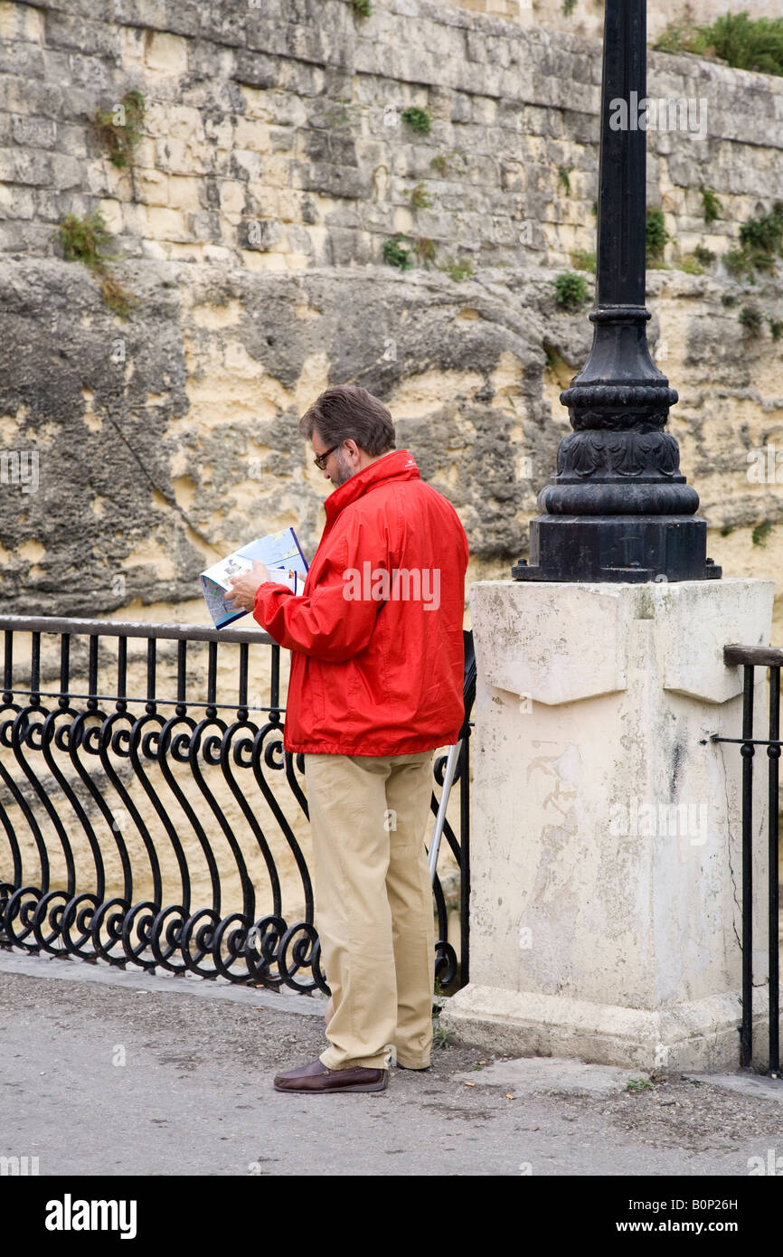 Norwegian tourist reading and checking map in Valletta, Malta Stock Photo