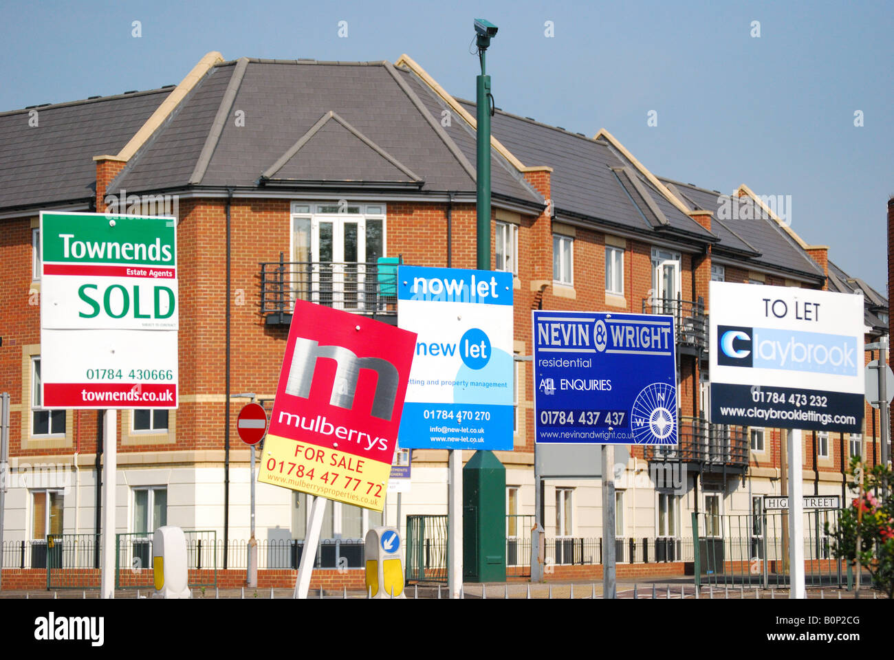 Estate agent signs, High Street, Egham, Surrey, England, United Kingdom