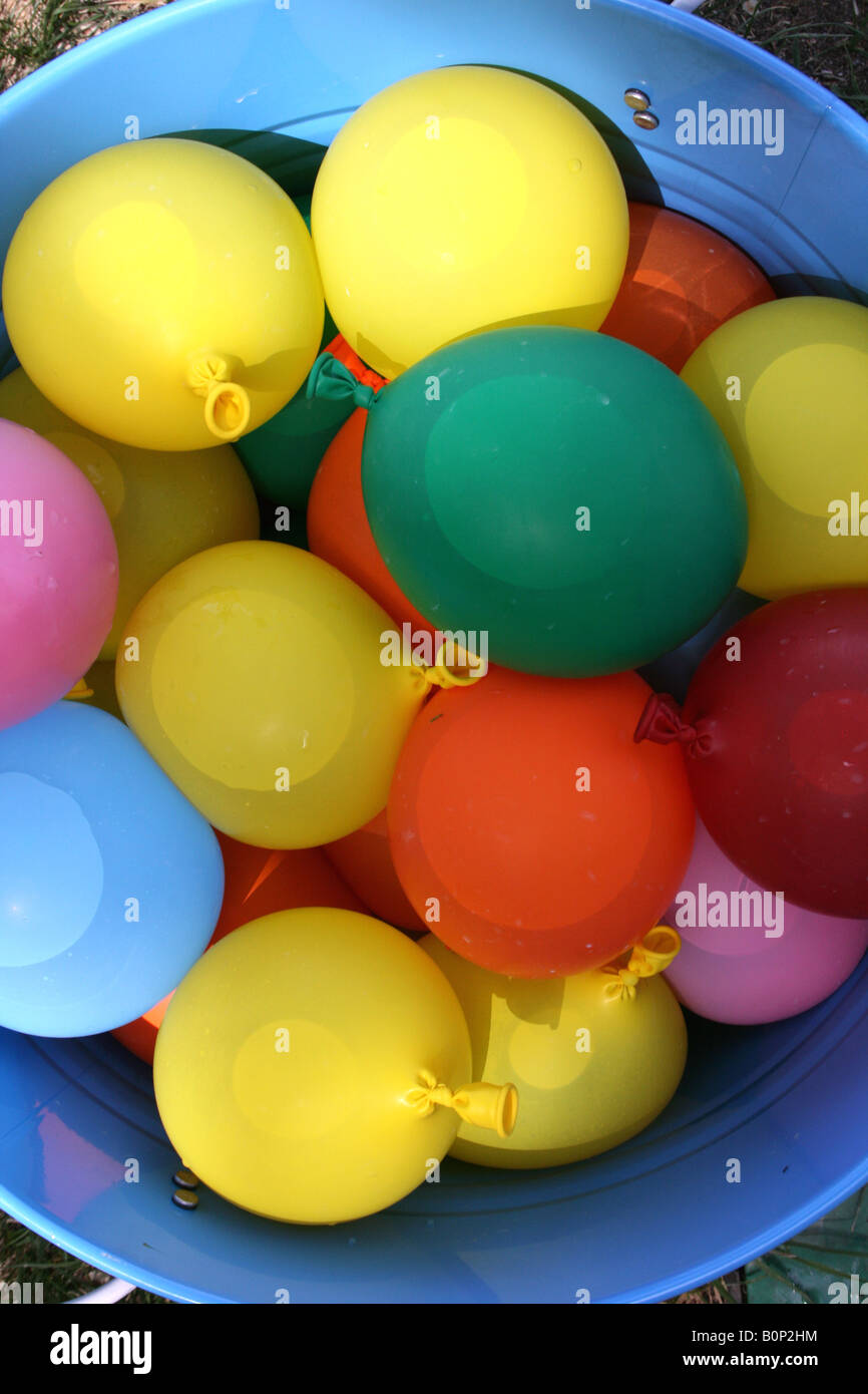 blue bucket containing water balloons Stock Photo - Alamy