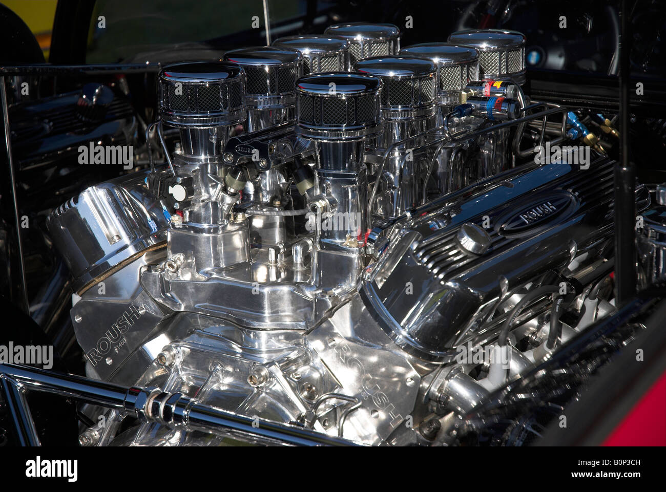 A Roush racing engine, totally polished, sitting in the engine bay of a De Tomaso Pantera at Concorso Italiano Stock Photo