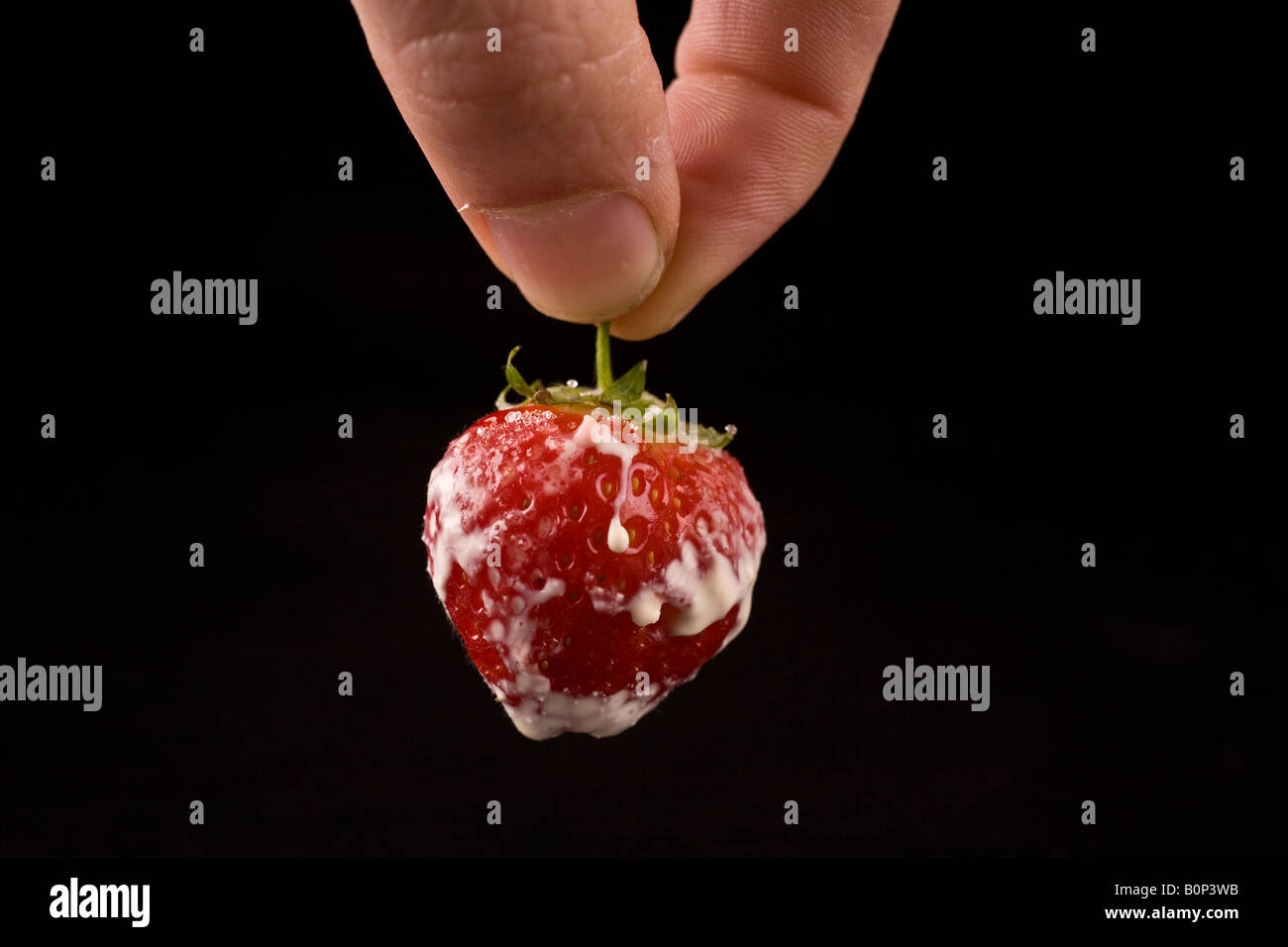 Pinching a strawberry Stock Photo