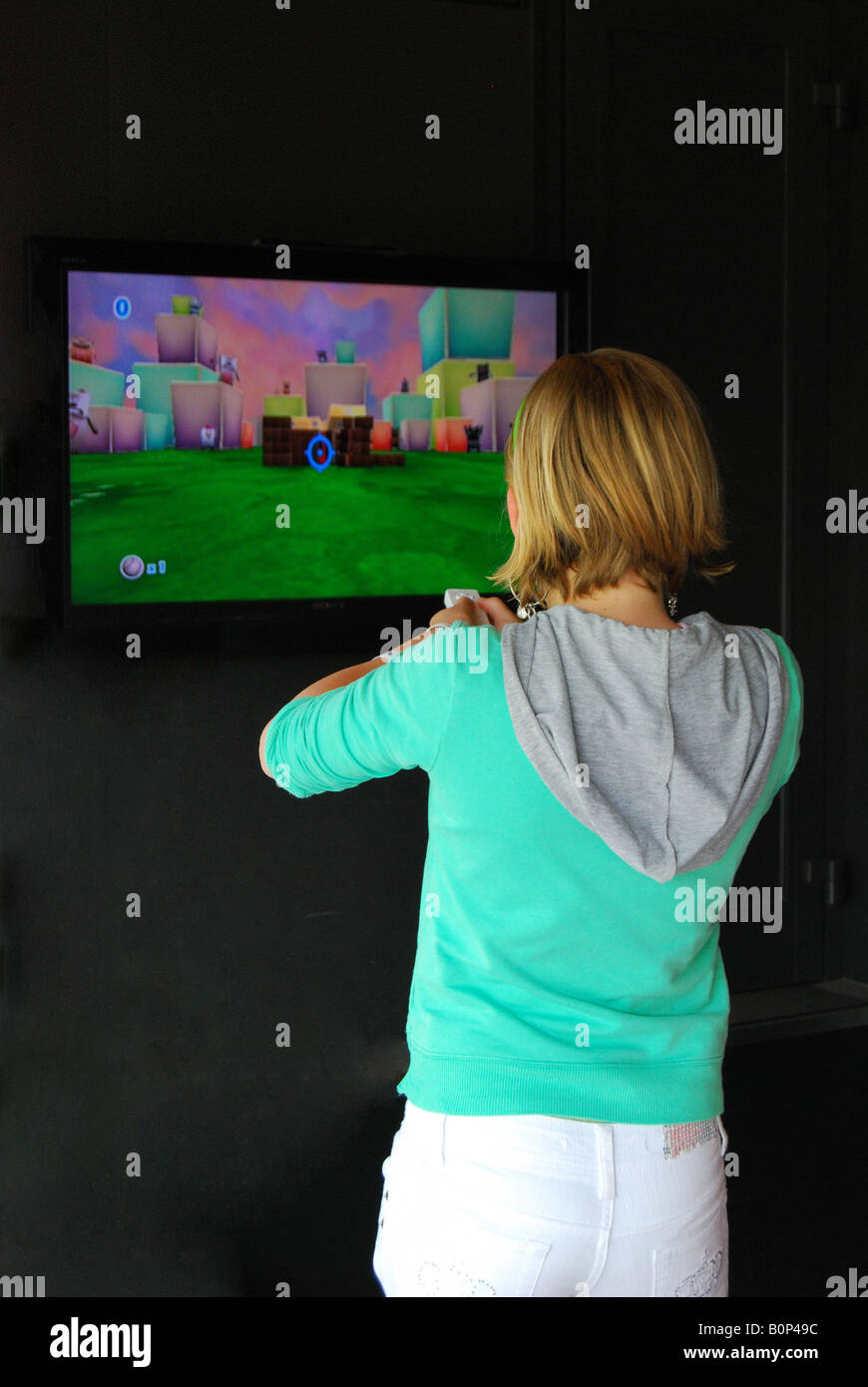 Girl playing computer game, Royal Windsor Horse Show, Home Park, Windsor, Berkshire, England, United Kingdom Stock Photo