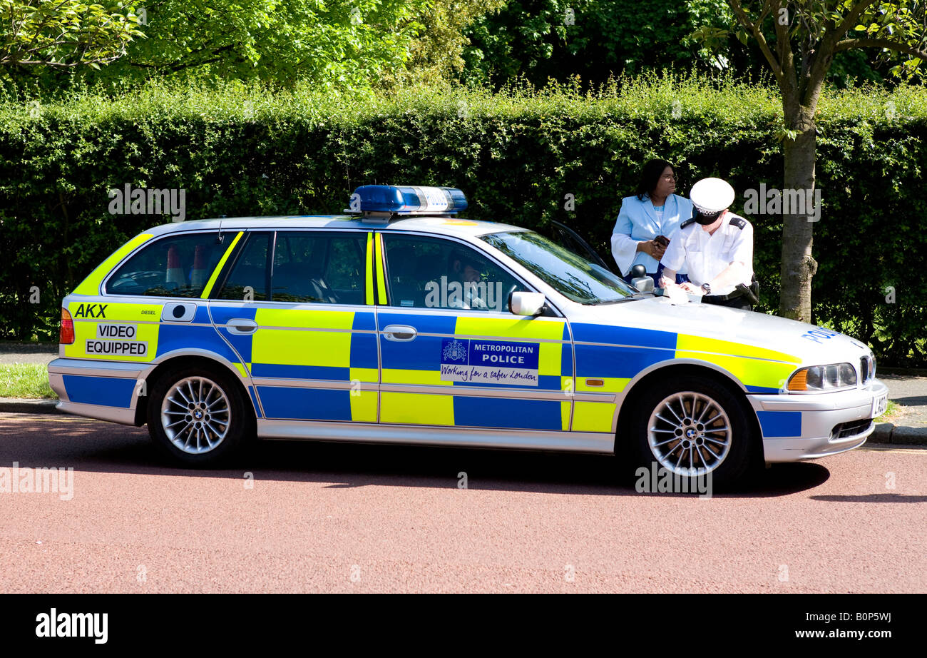 Policeman Stopping A motorist In Regents Park London UK Europe Stock Photo