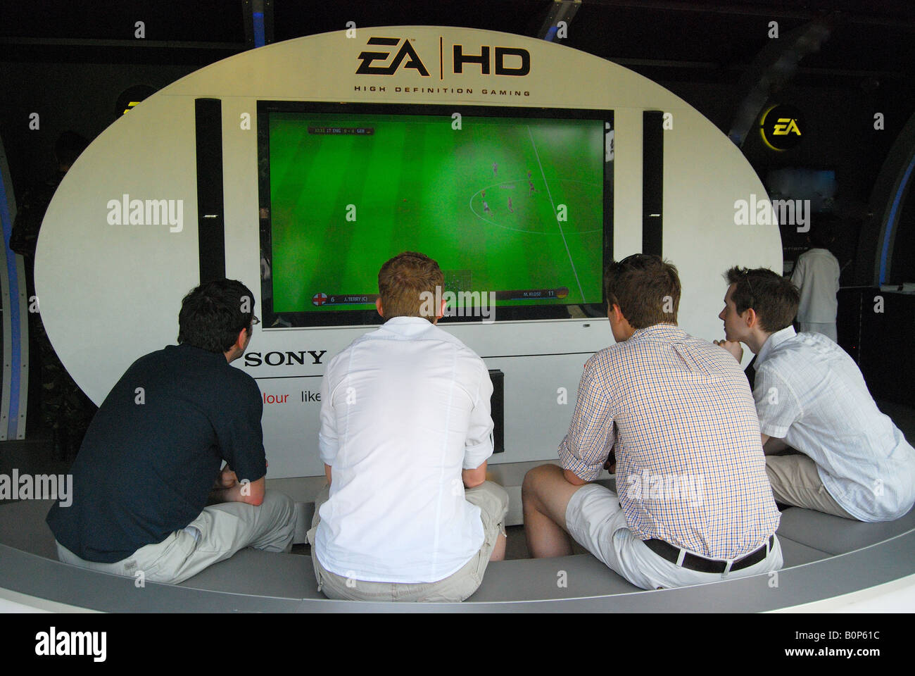 Boys playing computer game, Royal Windsor Horse Show, Home Park, Windsor, Berkshire, England, United Kingdom Stock Photo