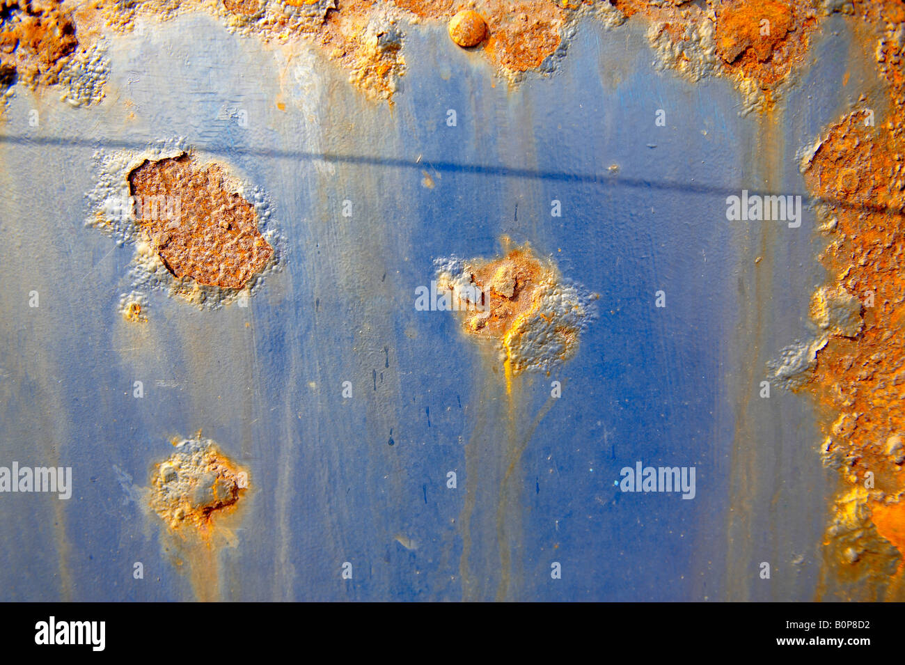 Close up of rusting blue metal sheet Stock Photo