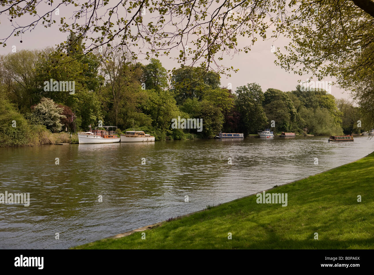 Pleasure boats on the River Thames in Berkshire viewed from Windsor Home Park, Windsor Castle Stock Photo