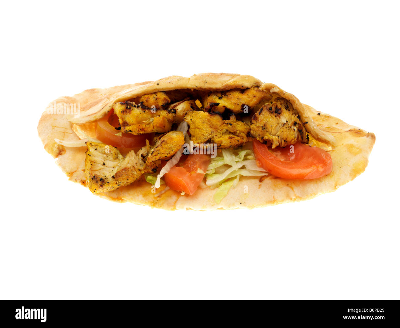 Fresh Tasty Mediterranean Style Chicken Kebab With Salad In Pitta Bread Isolated Against A White