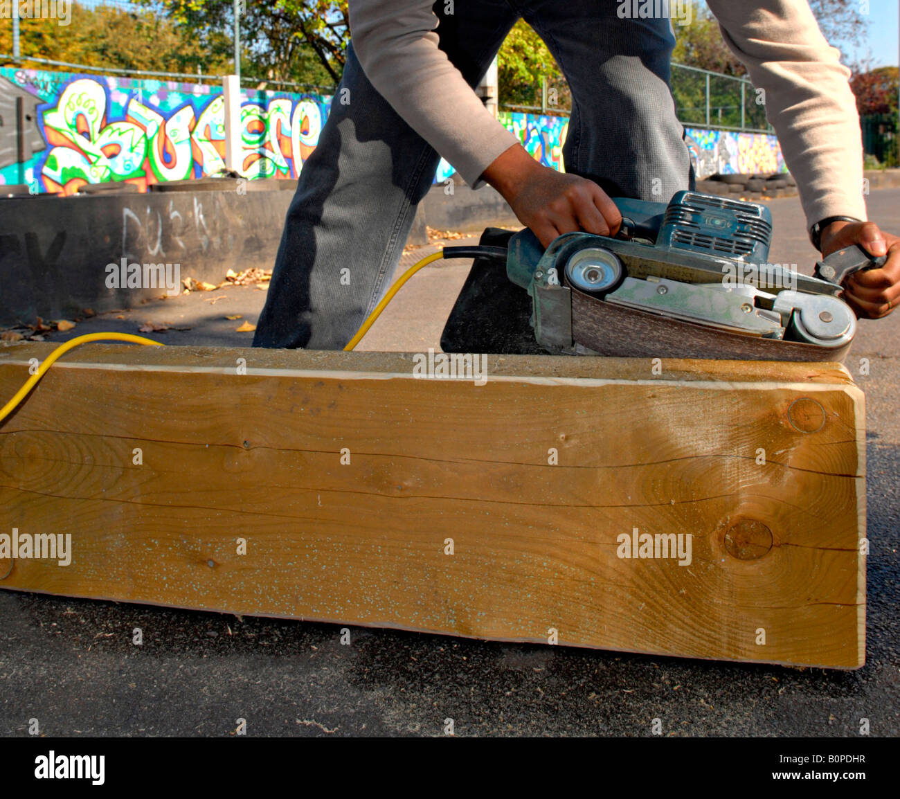 Person using Electric Power Sander Stock Photo Alamy