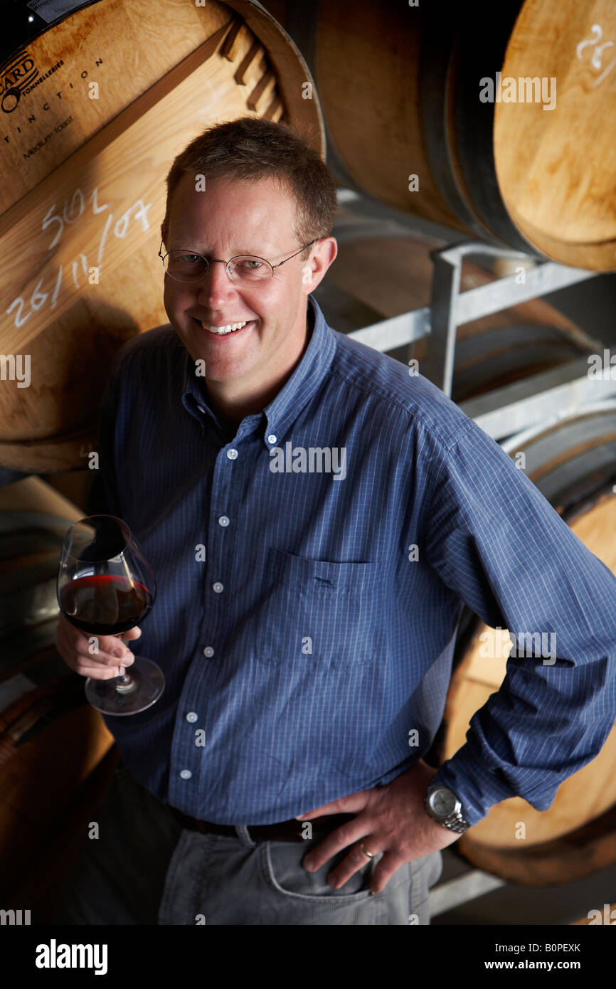 wine maker checking crate of wine Stock Photo Alamy