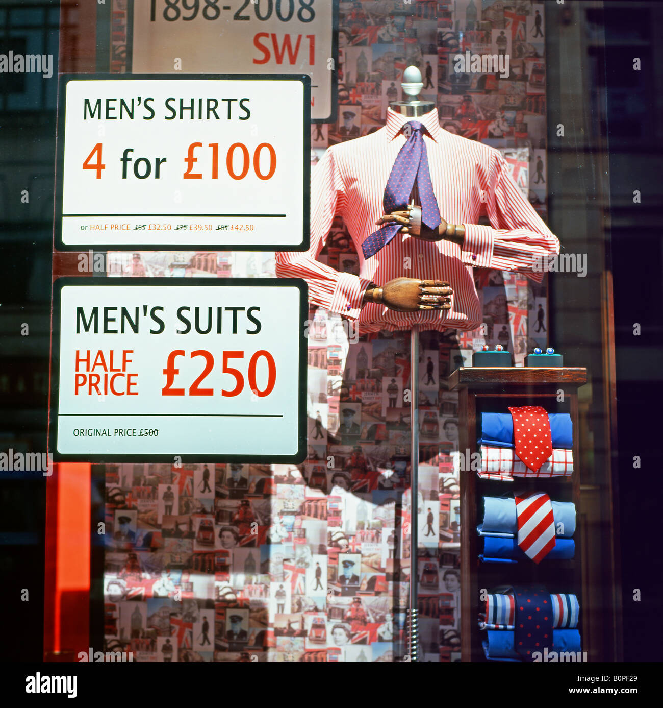 Menswear sale notices in a shop window London, England UK KATHY DEWITT  Stock Photo - Alamy