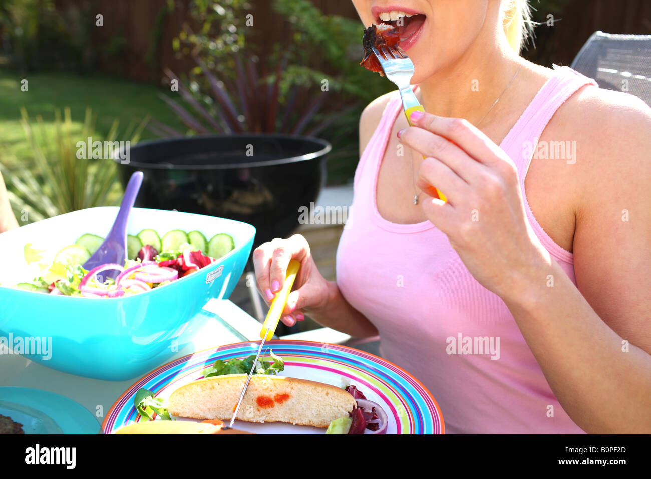 Young Woman Eating Sausage Model Released Stock Photo Alamy
